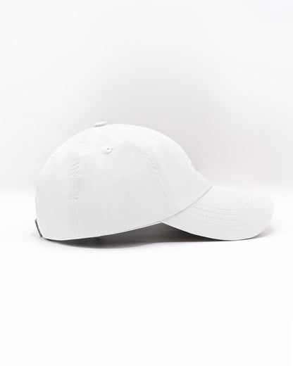 DC2 Resort Cap in White — side view showing the low-profile fit, curved brim, and smooth cotton twill finish.