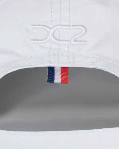 Back detail of the DC2 Resort Cap in White — featuring tonal stitching and a woven tricolor accent tab.
