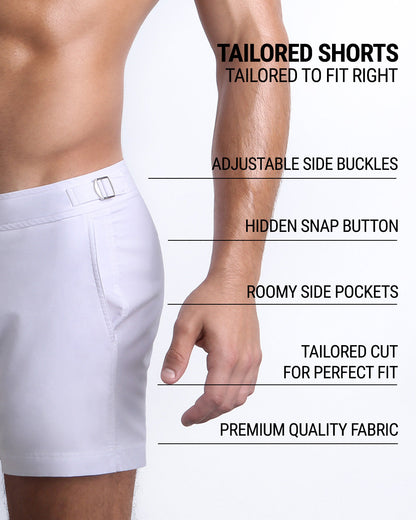 Infographic explaining the Tailored Shorts features and how they're tailored to fit every body form. They have hidden snap button with zipper, reinforced side pockets, and welded back pocket with zipper premium quality beach shorts for men.